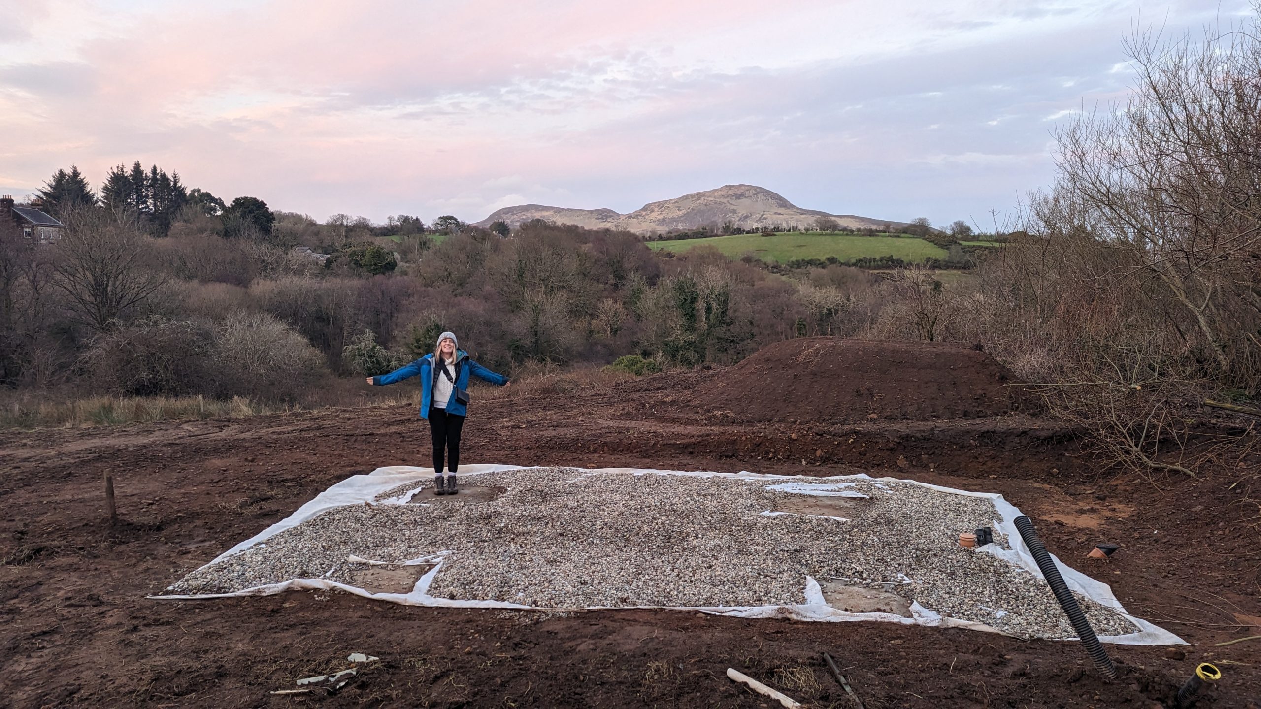 woman standing on shepherd hut plot